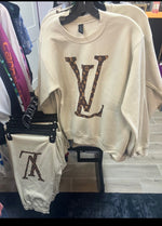 Cream crewneck sweatshirt and matching joggers with brown patterned LV graphics